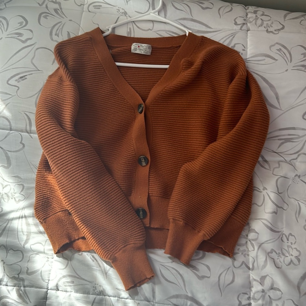 cropped dark orange button-up sweater. got it from tj-maxx one year ago.